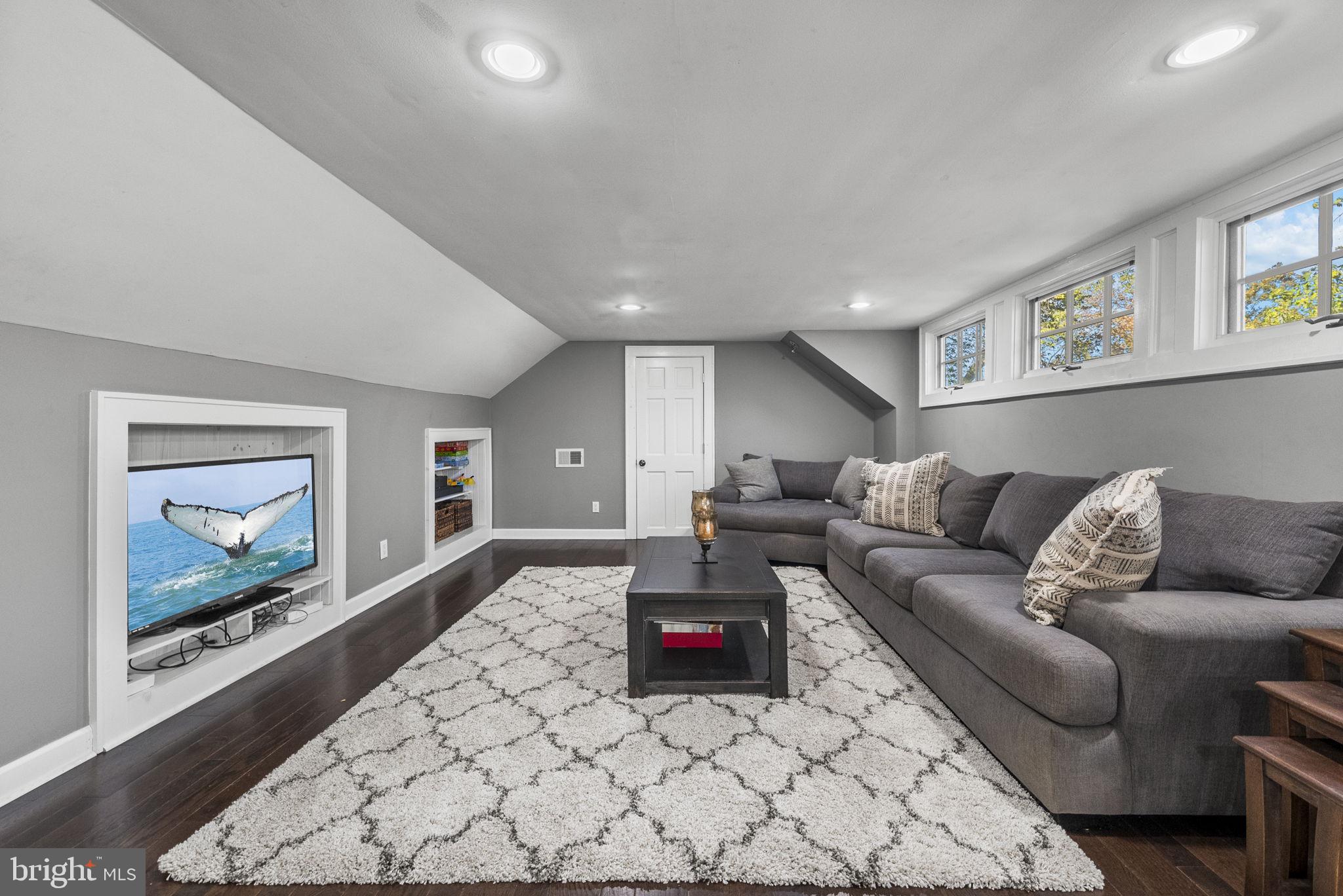 623 Montgomery Road Hillsborough, NJ 08844 - Photo 44 of 67 a living room with furniture and a flat screen tv