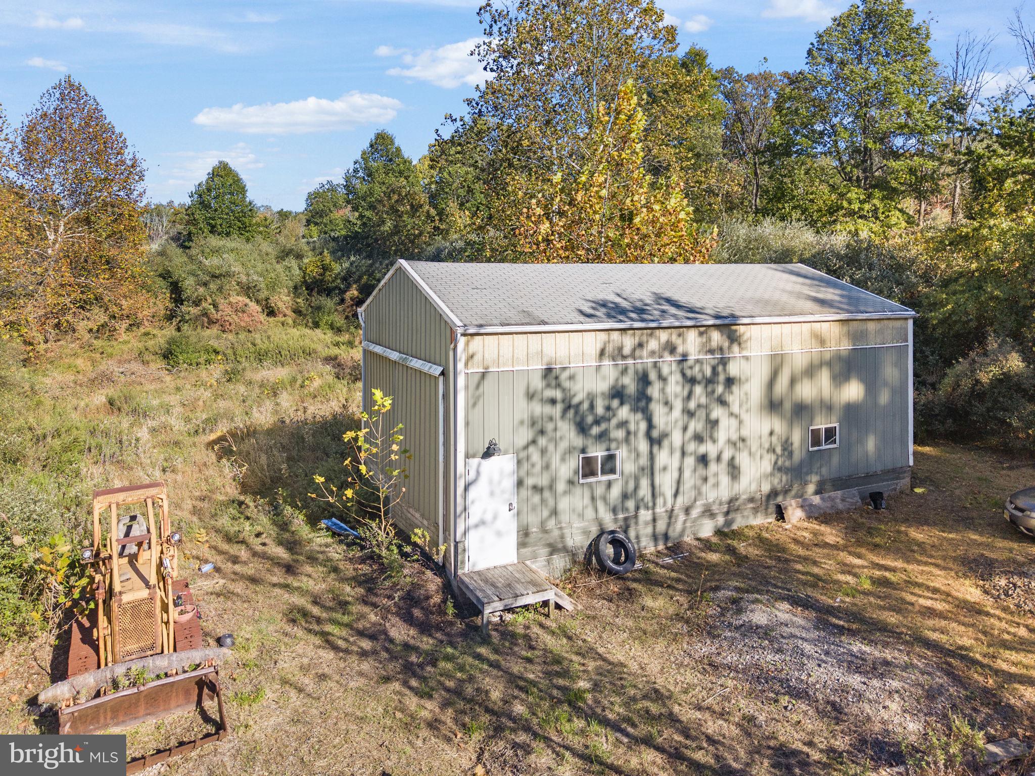 623 Montgomery Road Hillsborough, NJ 08844 - Photo 55 of 67 a view of a house with a tree in the background