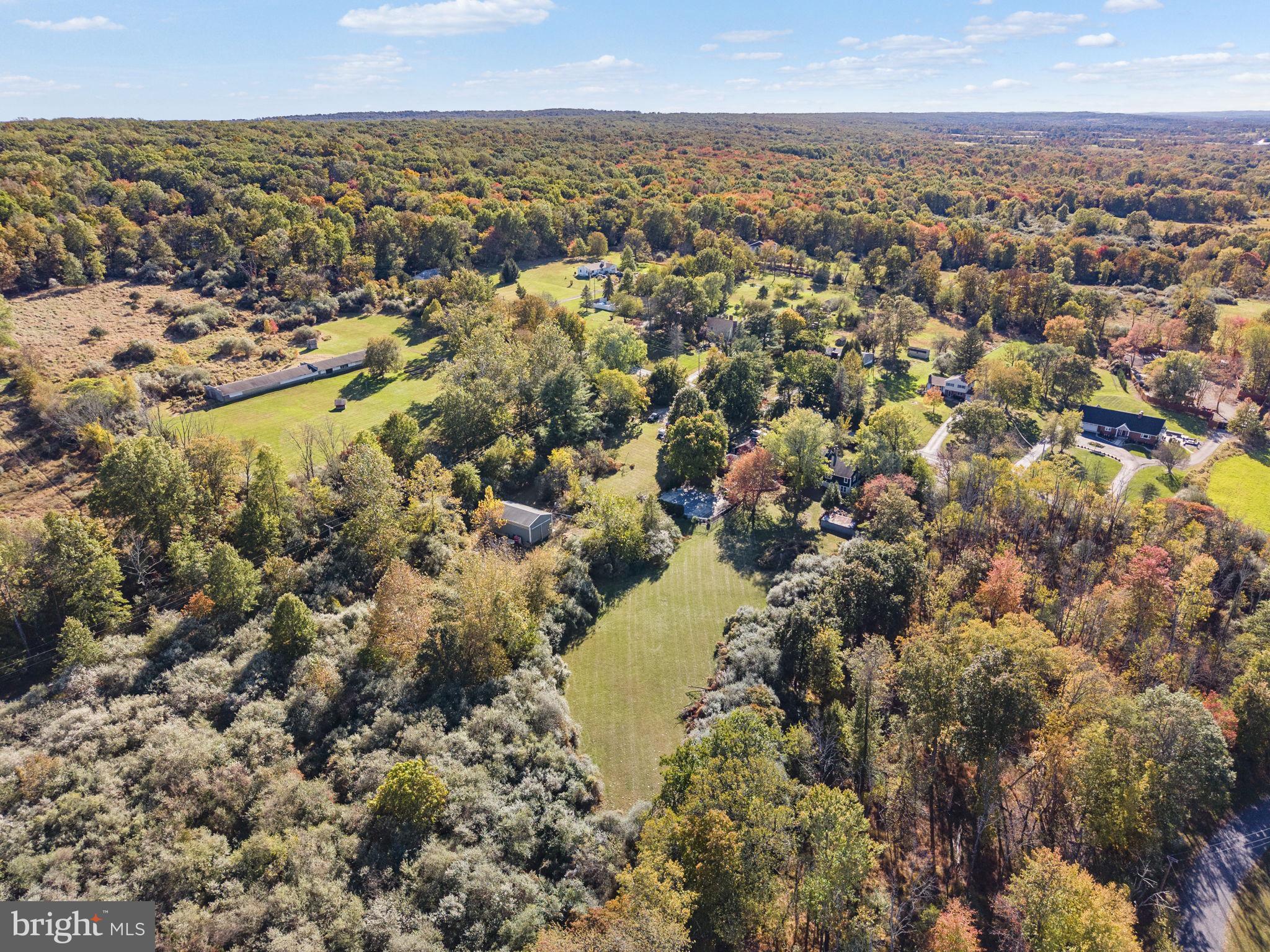 623 Montgomery Road Hillsborough, NJ 08844 - Photo 60 of 67 an aerial view of a houses with a lake