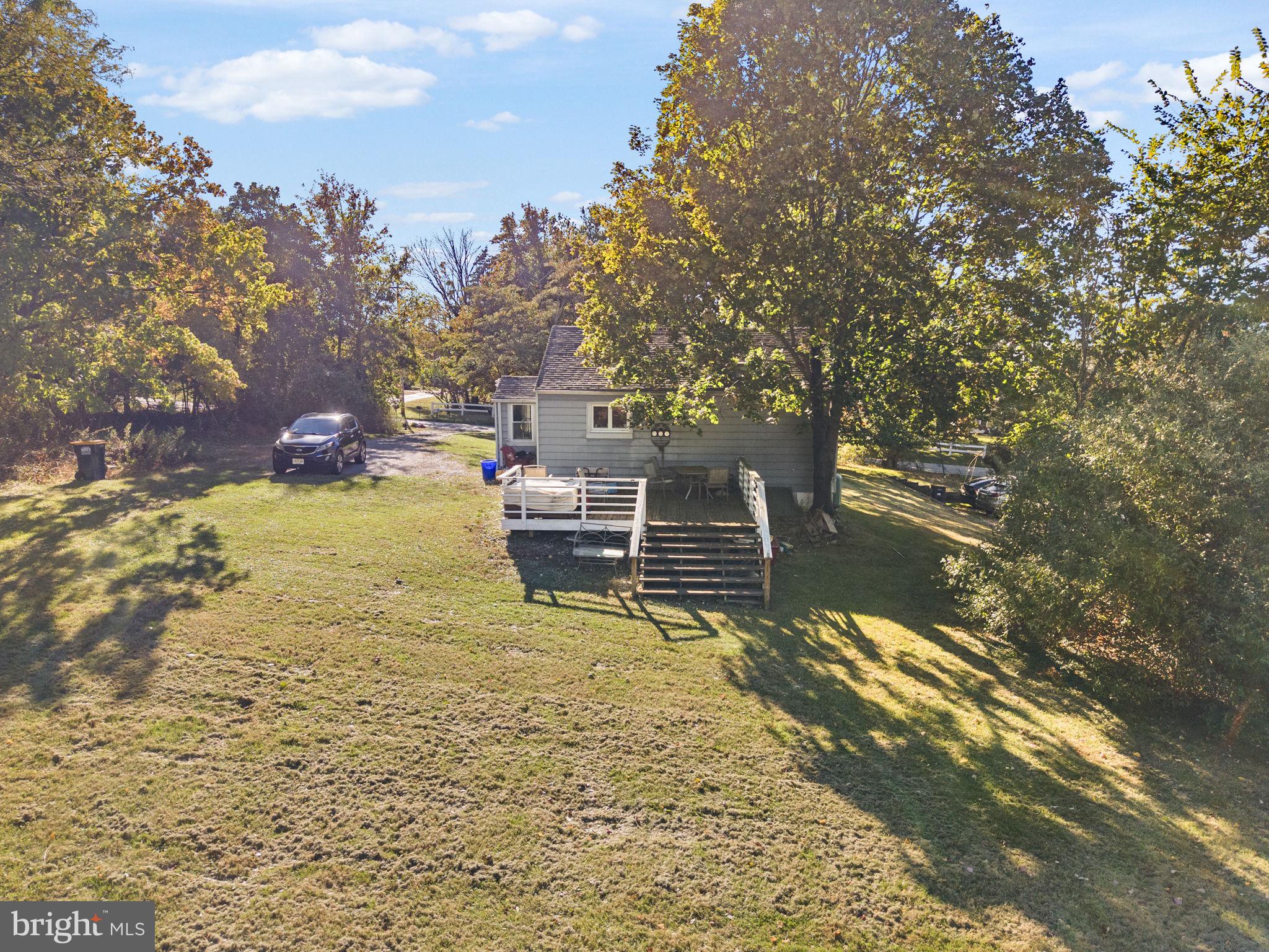 623 Montgomery Road Hillsborough, NJ 08844 - Photo 10 of 67 a view of a lake with table and chairs