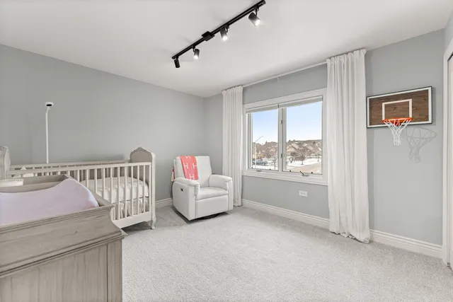 a bedroom with bed and window