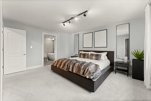 a bedroom with a bed and window