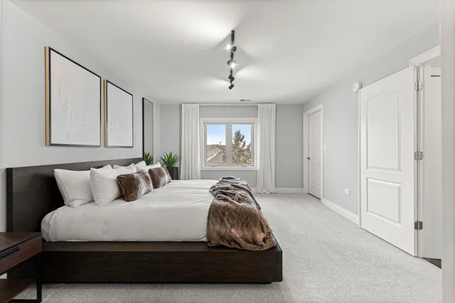 a kitchen with stainless steel appliances a sink and a refrigerator