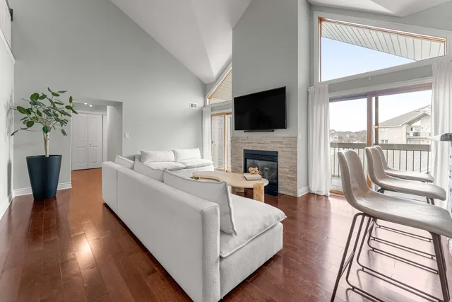 a living room with furniture fireplace and a flat screen tv