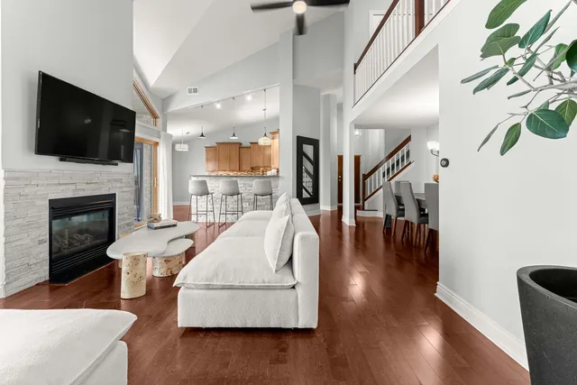 a living room with furniture fireplace and flat screen tv