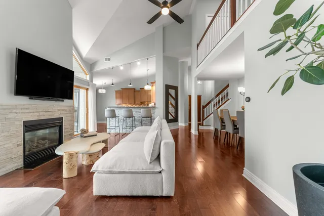 a living room with furniture fireplace and flat screen tv