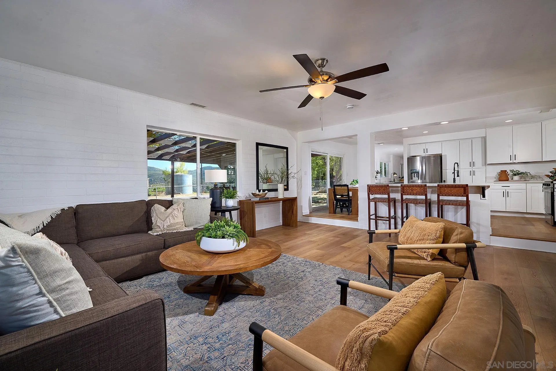 6185 Alpine Boulevard Alpine, CA 91901 - Photo 2 of 39 a living room with furniture and a view of kitchen