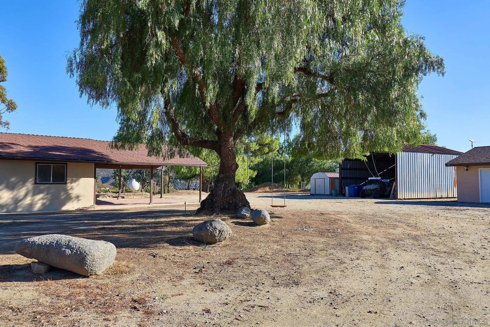 6185 Alpine Boulevard Alpine, CA 91901 - Photo 22 of 39 a view of a backyard with large trees