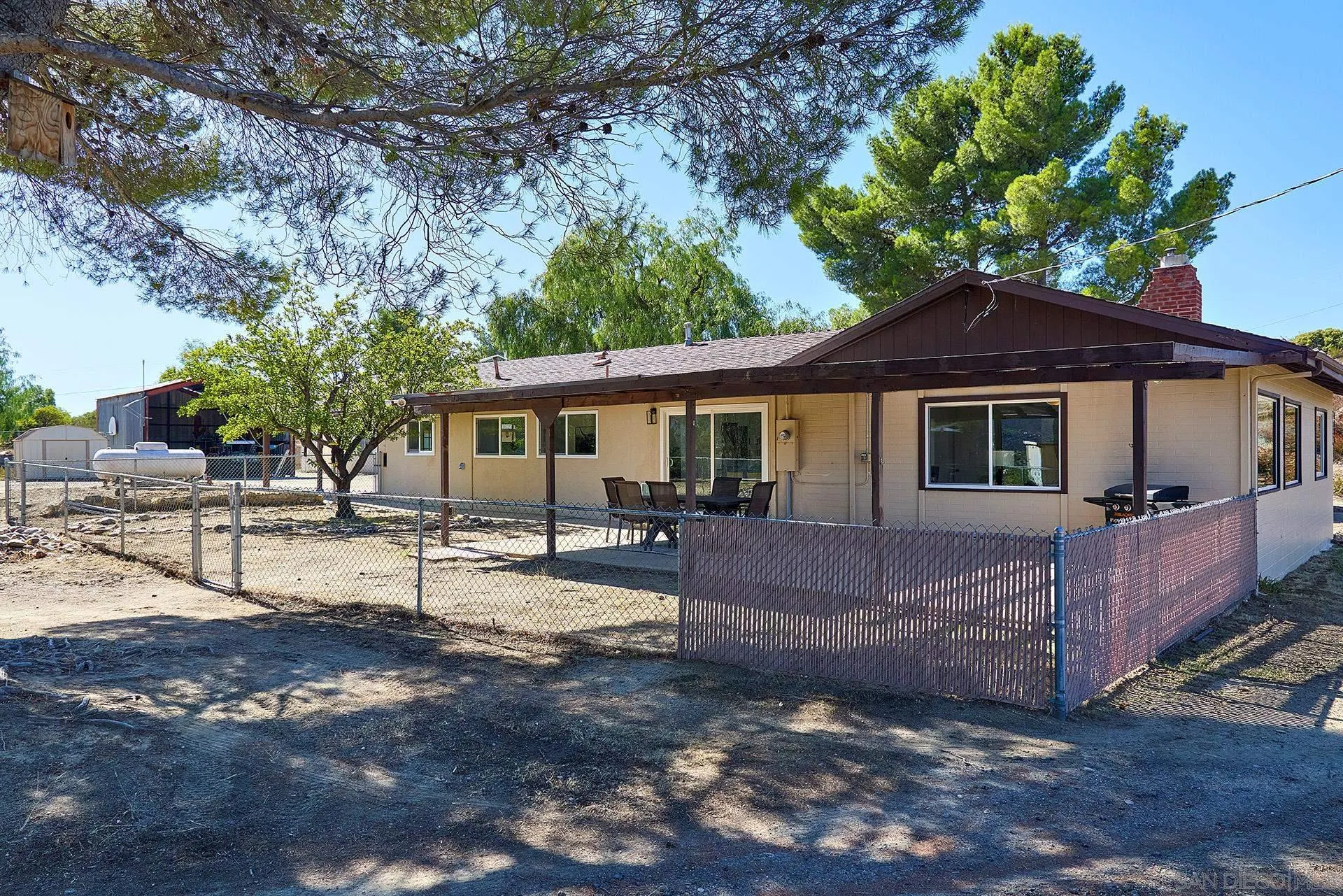 6185 Alpine Boulevard Alpine, CA 91901 - Photo 23 of 39 a view of a house with a yard and sitting area