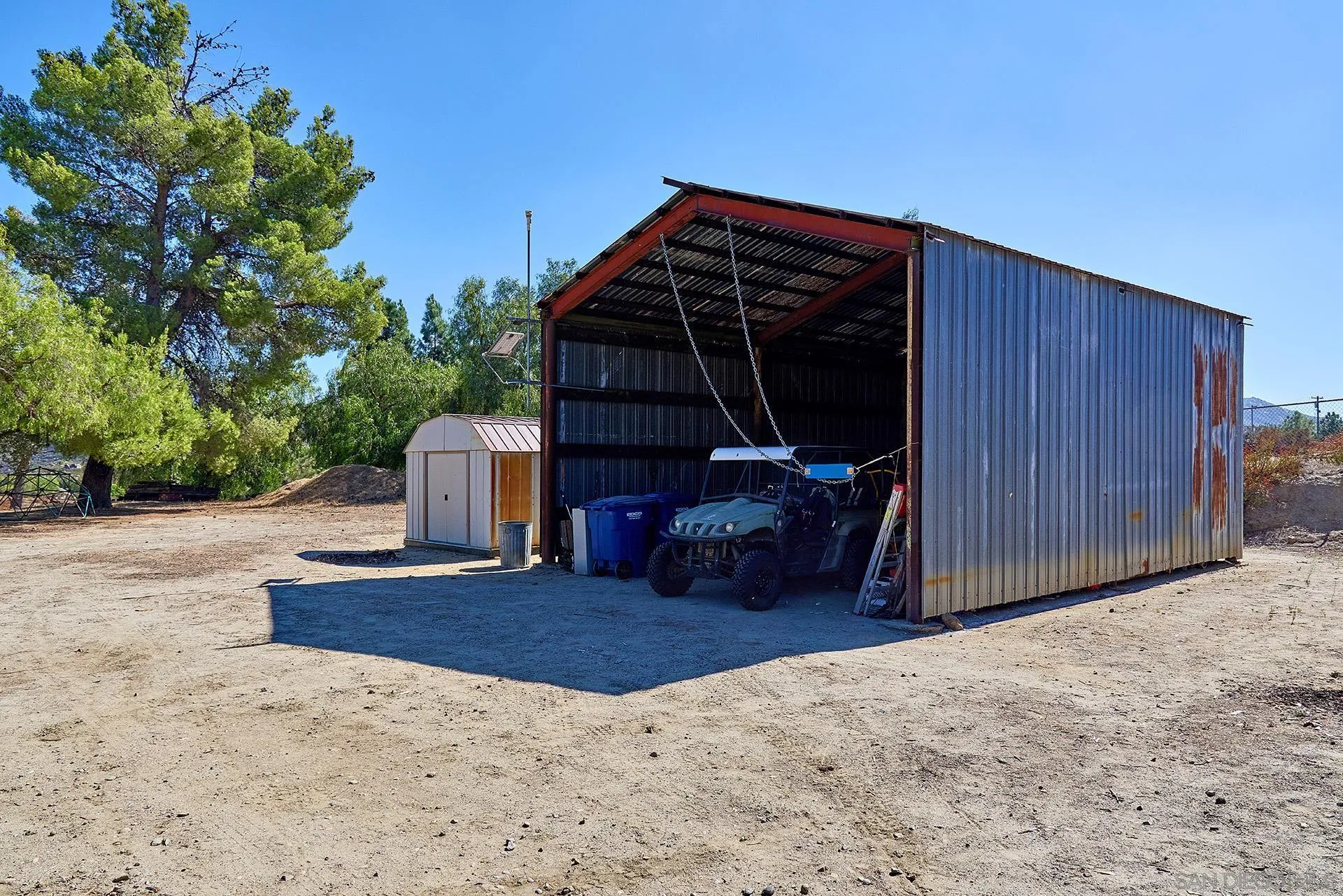 6185 Alpine Boulevard Alpine, CA 91901 - Photo 34 of 39 a view of backyard with wooden fence and trees