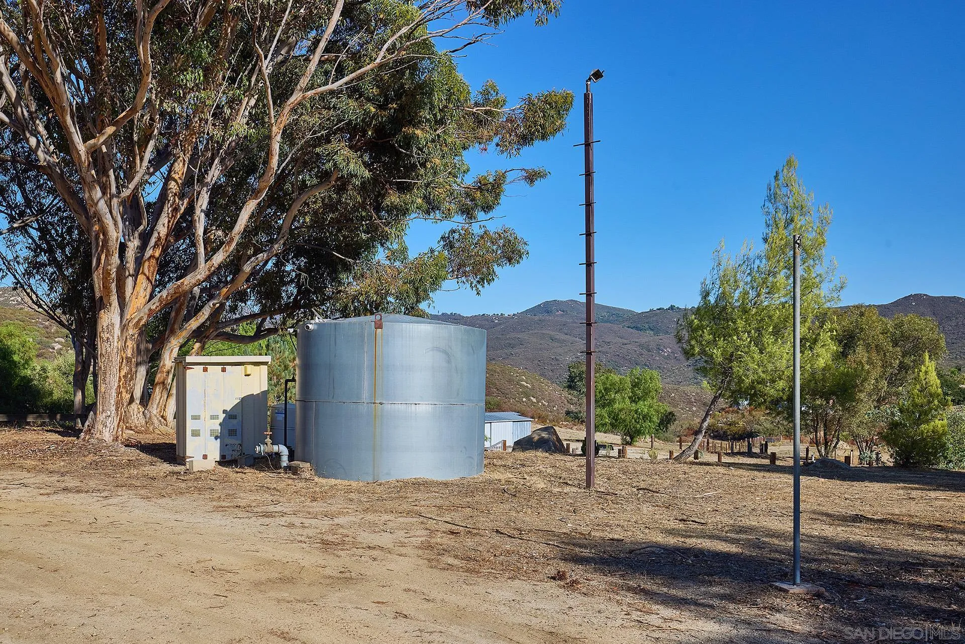 6185 Alpine Boulevard Alpine, CA 91901 - Photo 35 of 39 a backyard of a house with a tree