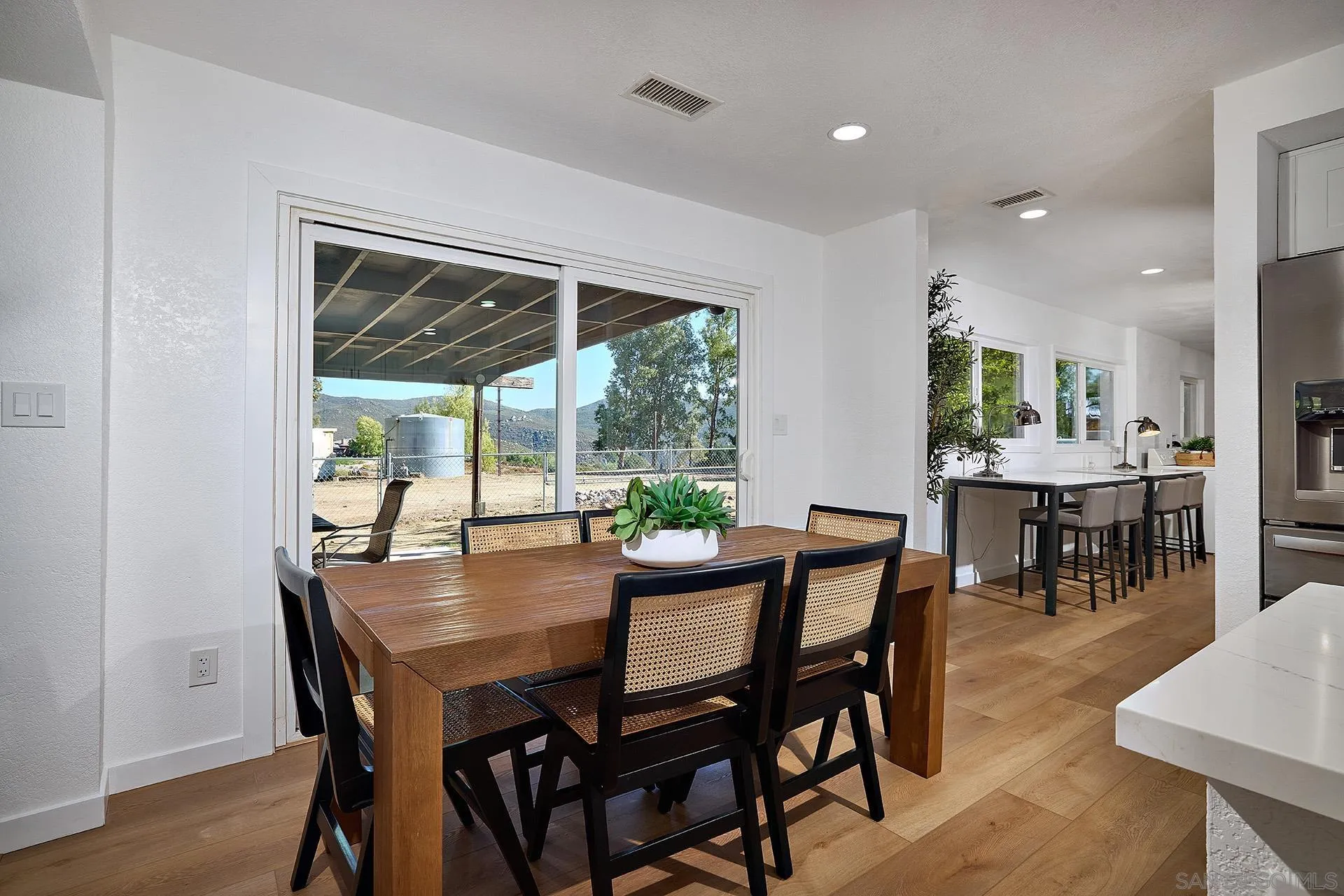 6185 Alpine Boulevard Alpine, CA 91901 - Photo 9 of 39 a view of a dining room with furniture window and outside view