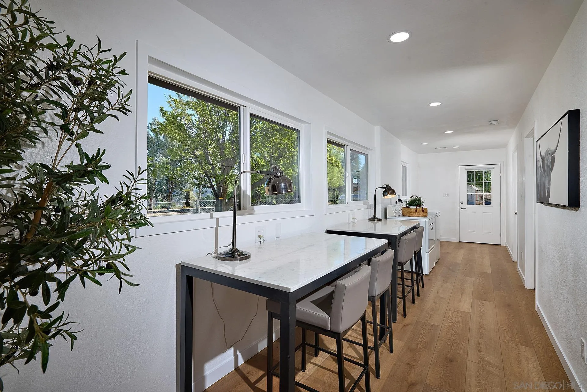 6185 Alpine Boulevard Alpine, CA 91901 - Photo 10 of 39 a view of a dining room with furniture window and wooden floor