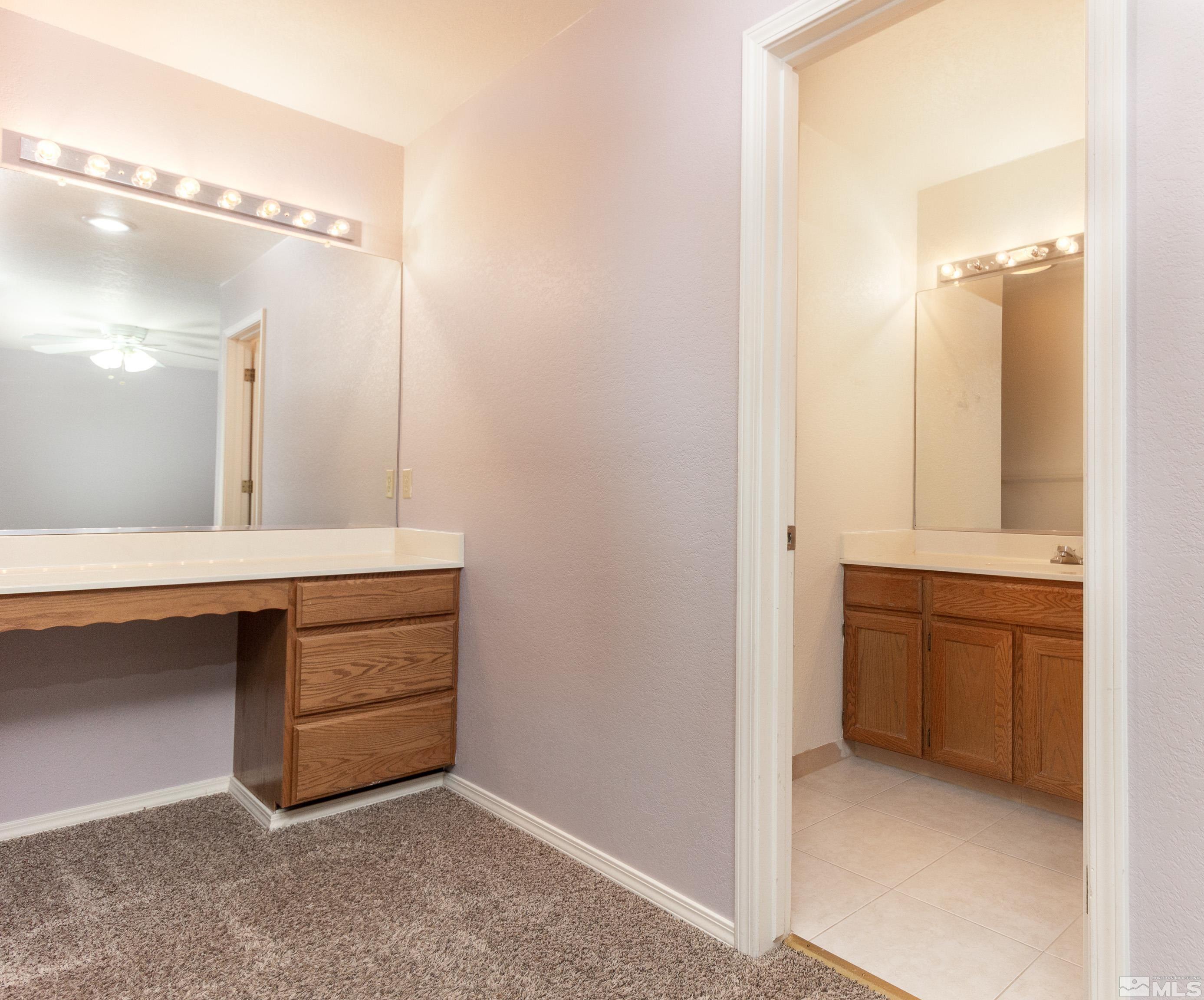 5331 Coit Drive Reno, NV 89523 - Photo 13 of 28 a bathroom with a sink and a mirror