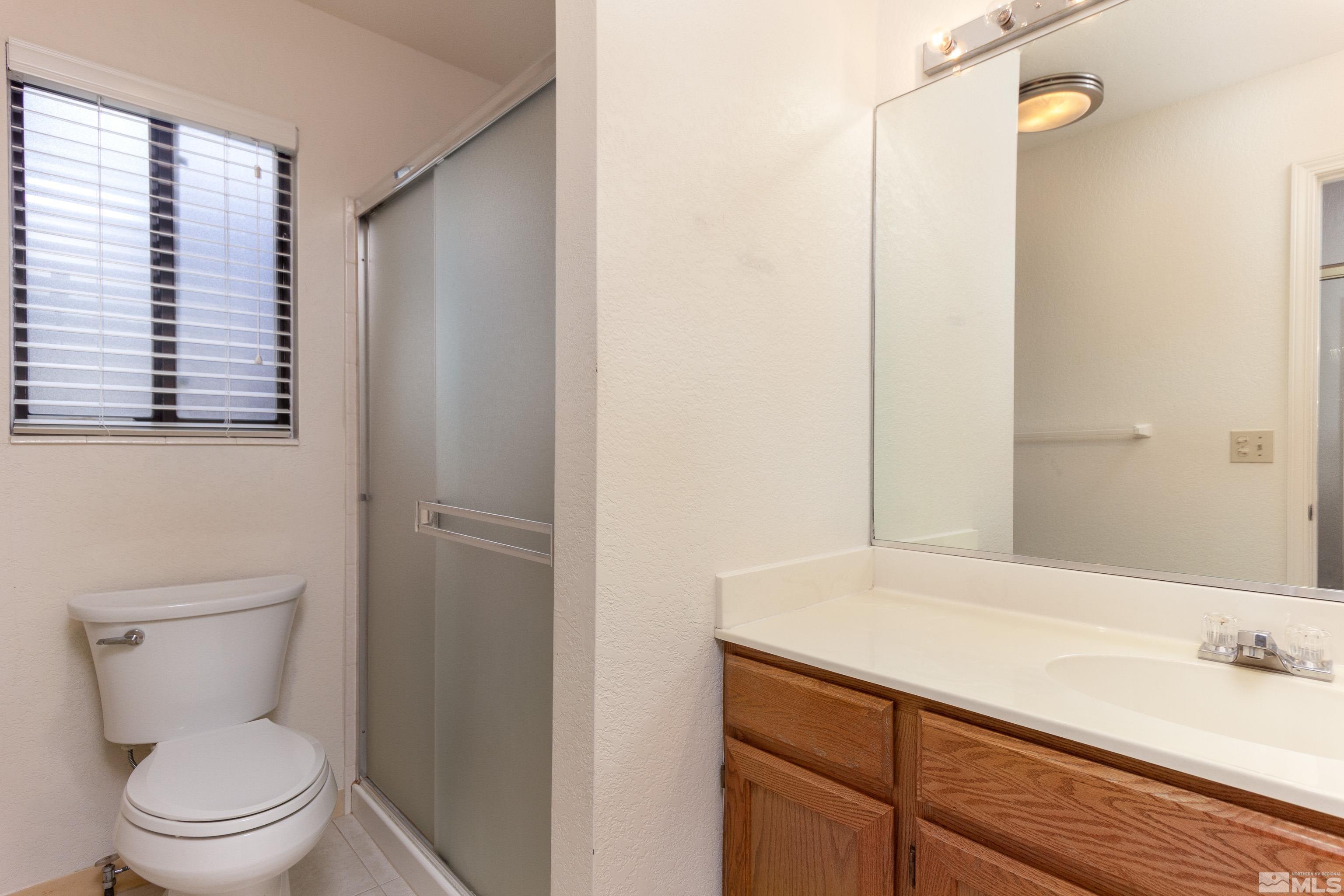 5331 Coit Drive Reno, NV 89523 - Photo 14 of 28 a bathroom with a sink a toilet and shower