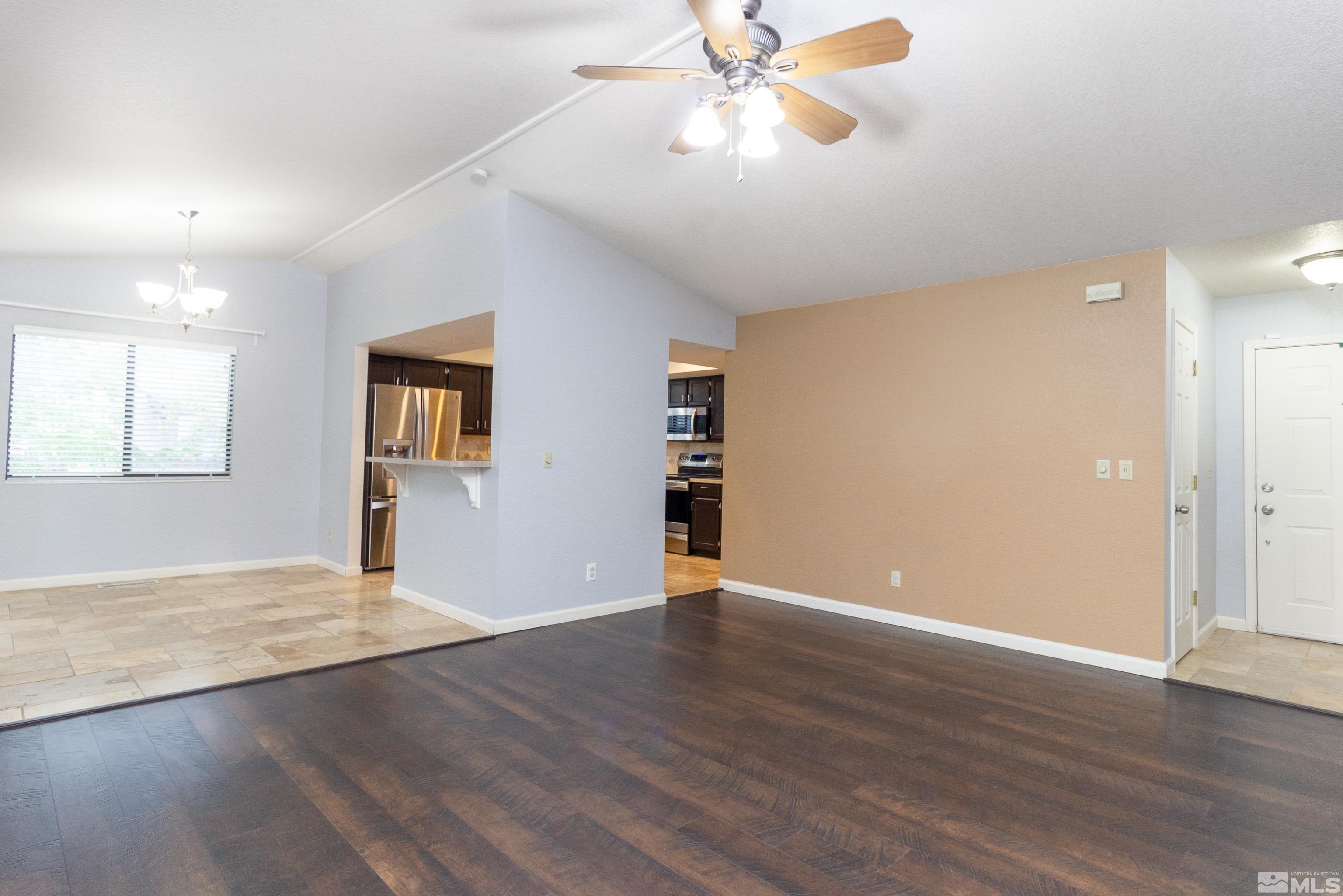 5331 Coit Drive Reno, NV 89523 - Photo 19 of 28 a view of an empty room with wooden floor and a window