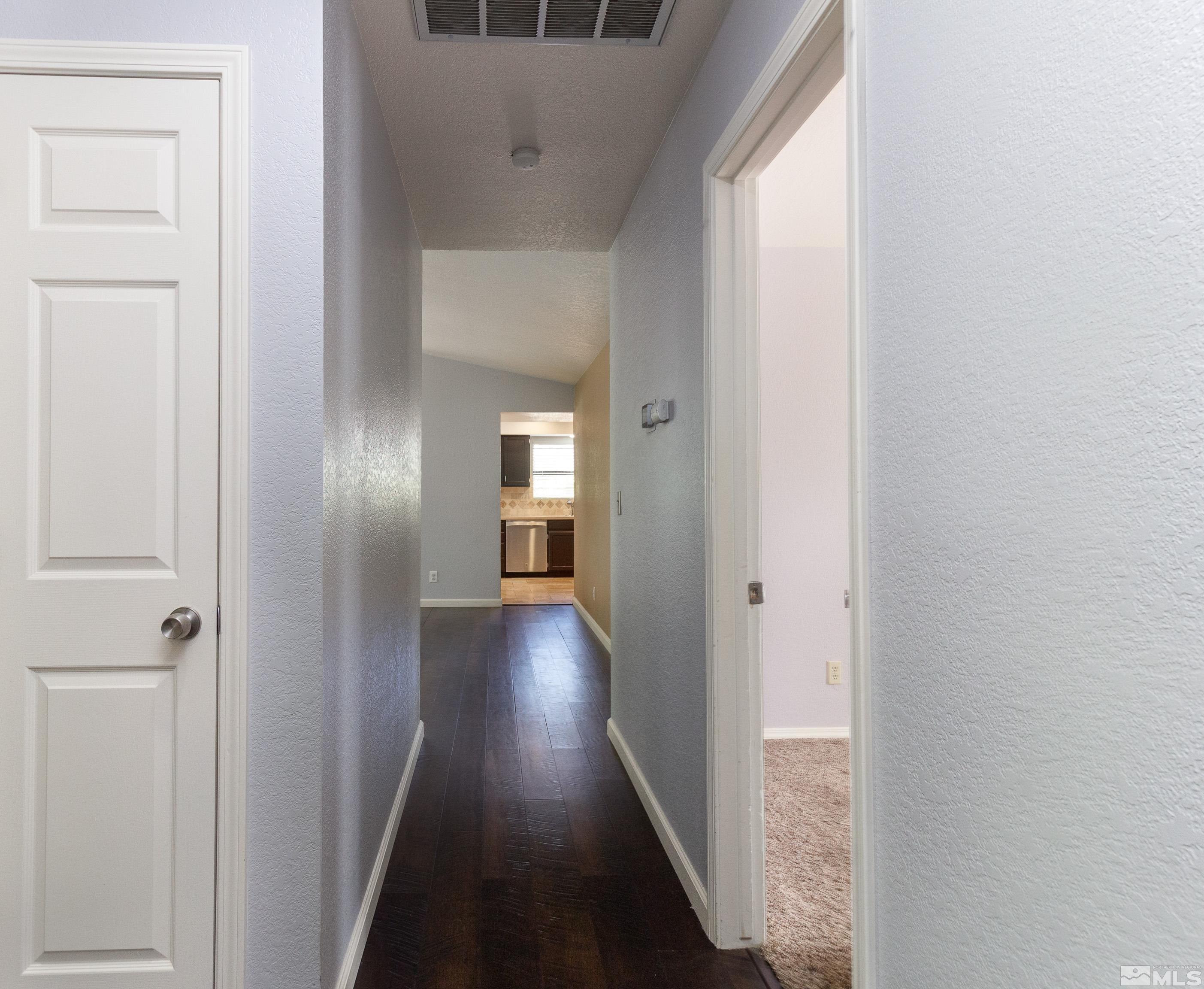 5331 Coit Drive Reno, NV 89523 - Photo 21 of 28 a view of a hallway with wooden floor and closet