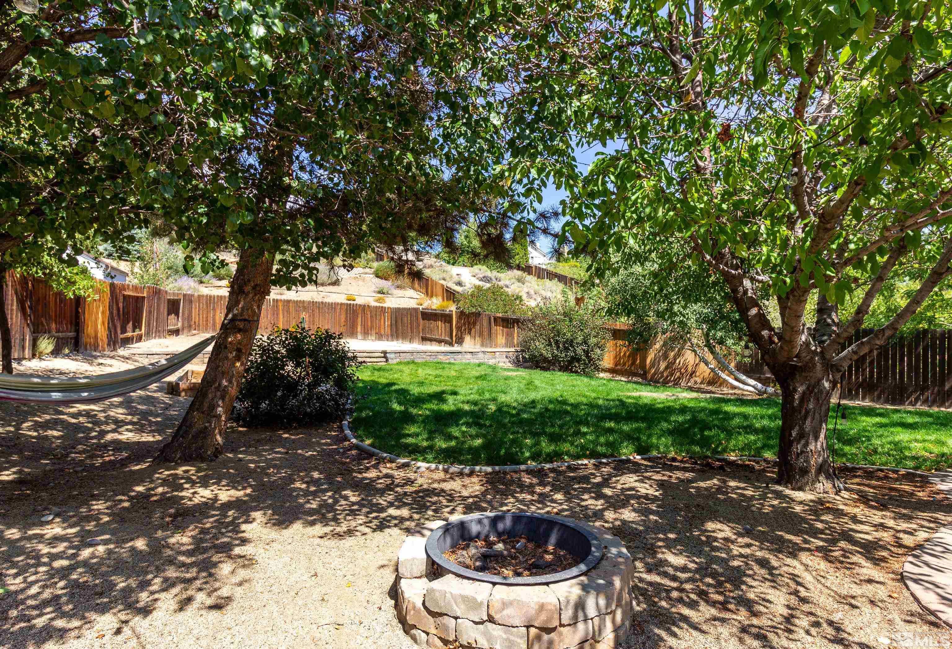 5331 Coit Drive Reno, NV 89523 - Photo 5 of 28 a patio with table and chairs and potted plants