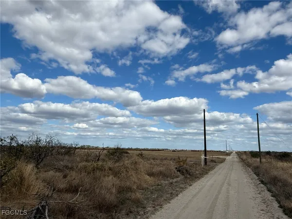 a view of a dry yard with sitting space