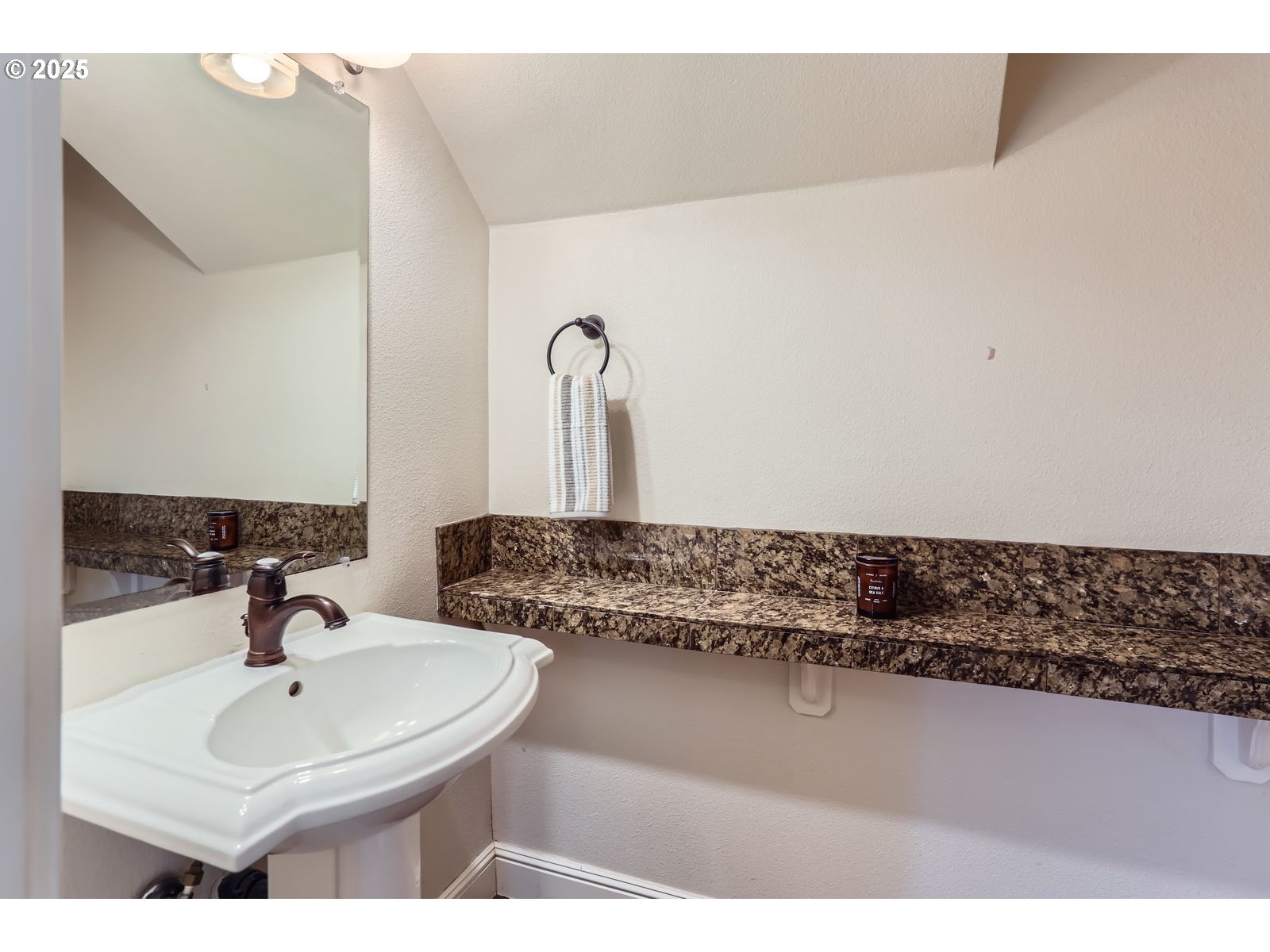 343 Northeast Bryant Street Portland, OR 97211 - Photo 13 of 26 a bathroom with a sink and a mirror