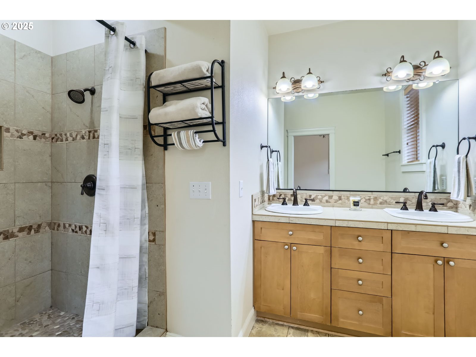 343 Northeast Bryant Street Portland, OR 97211 - Photo 17 of 26 a bathroom with a sink vanity and a mirror