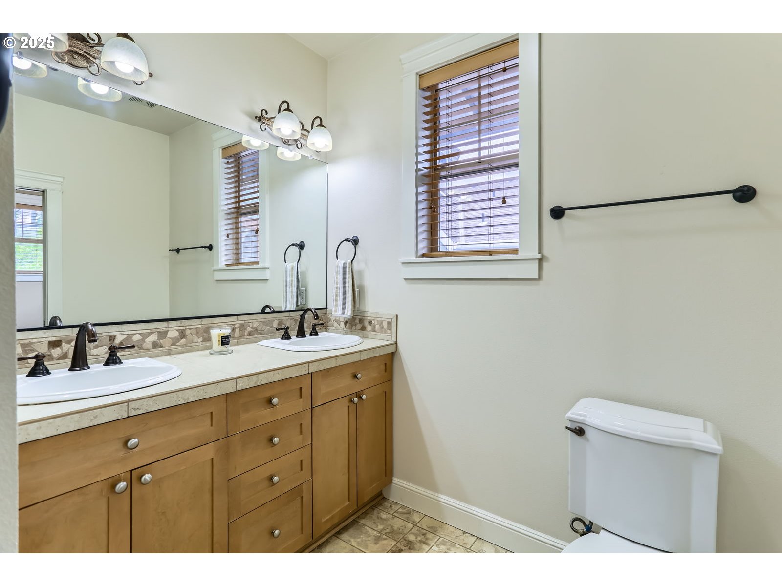 343 Northeast Bryant Street Portland, OR 97211 - Photo 18 of 26 a bathroom with a sink and a mirror