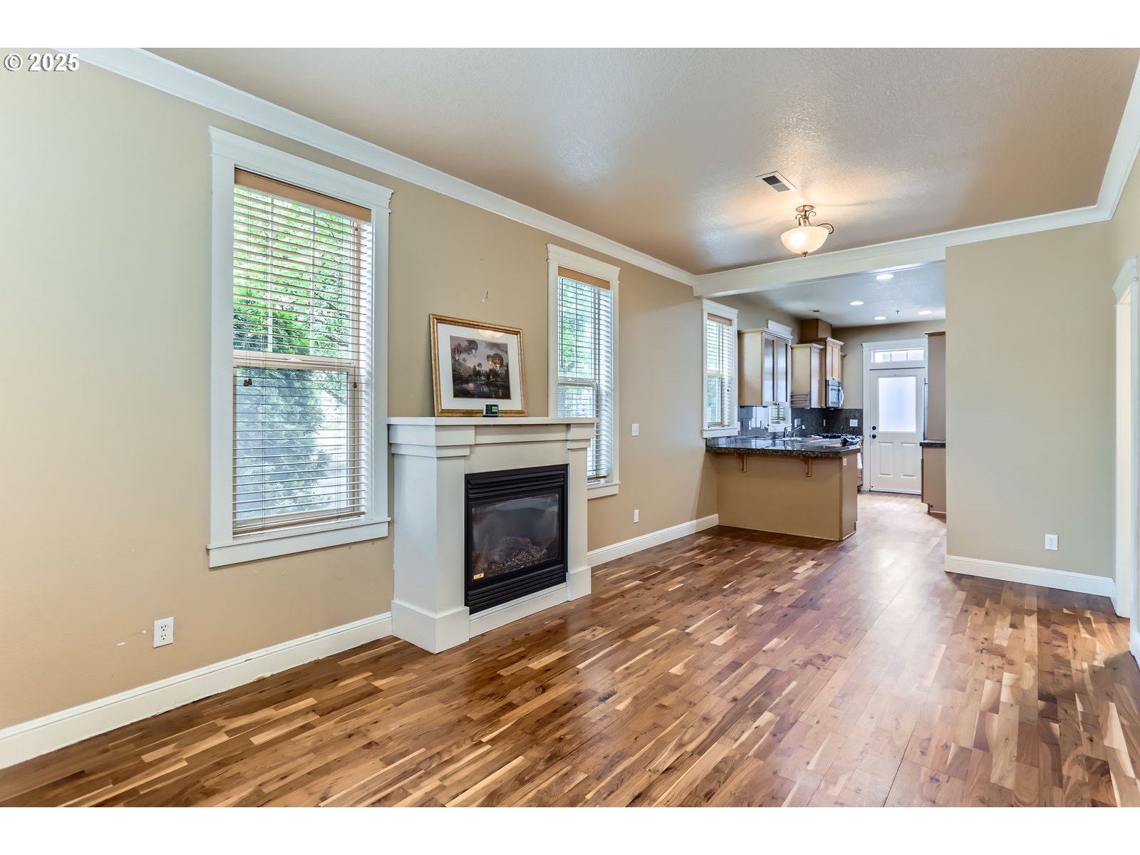 343 Northeast Bryant Street Portland, OR 97211 - Photo 5 of 26 a view of livingroom with furniture fireplace and wooden floor