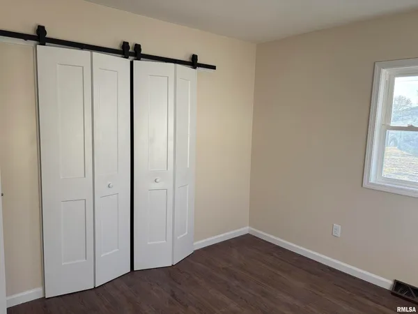 a view of a bathroom with wooden floor