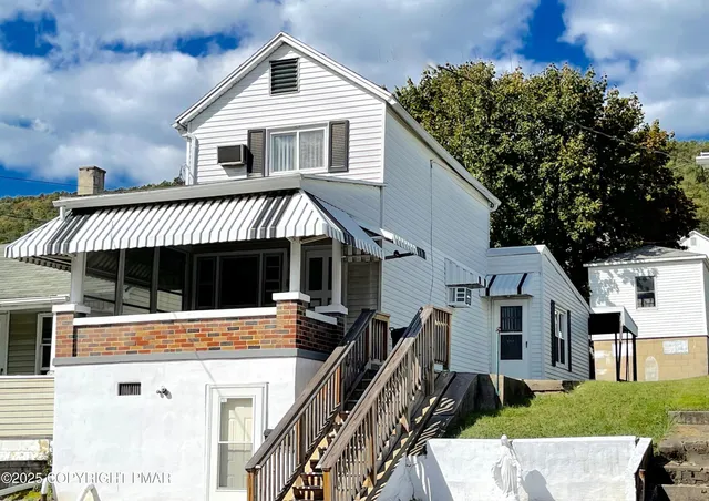 a view of a house with roof deck
