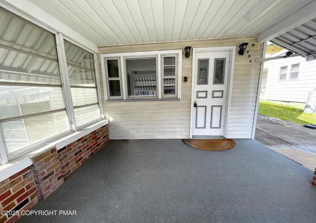 a view of swimming pool with outdoor seating