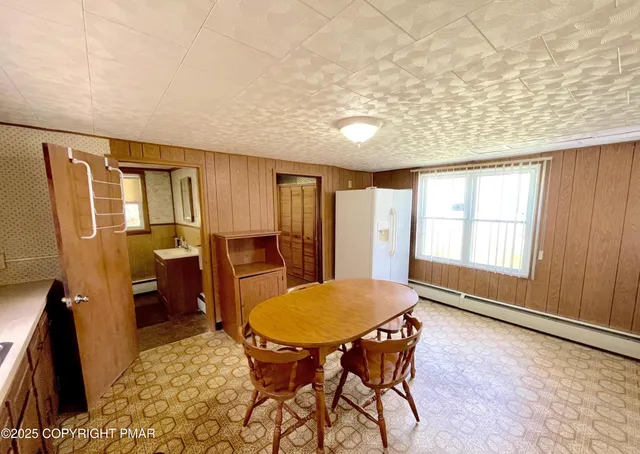 a view of a livingroom with furniture window and wooden floor