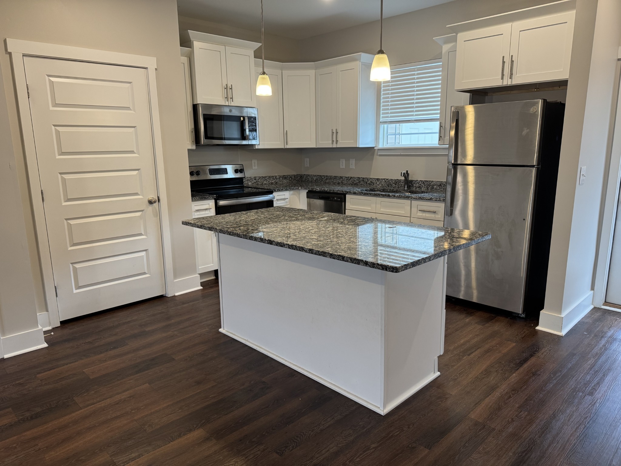 2003 Blossom Run Spring Hill Spring Hill, TN 37174 - Photo 5 of 12 a kitchen with granite countertop a refrigerator and a stove top oven