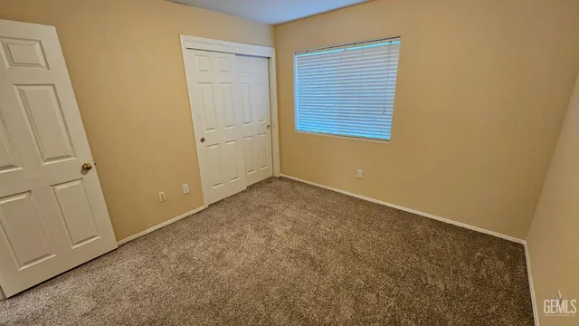 an empty room with a wooden door