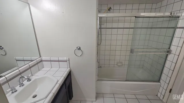 a bathroom with a sink a toilet a mirror and vanity