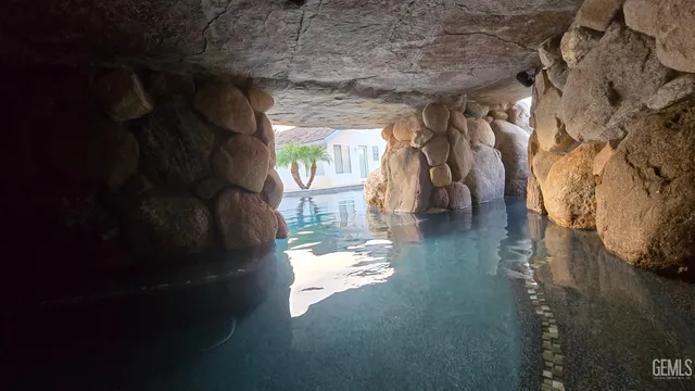 a view of houses with palm trees