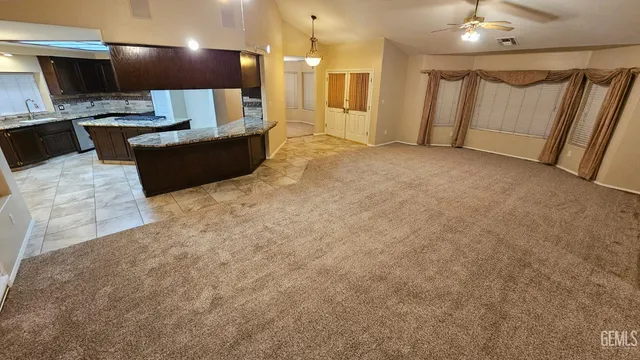 a bathroom with a sink a large mirror and a shower