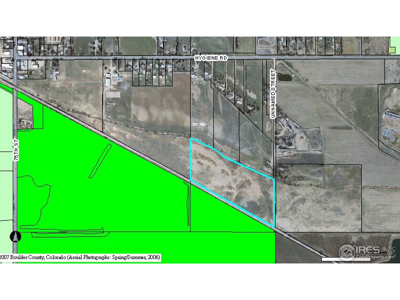 8090 Hygiene Road Longmont, CO 80503 - Photo 3 of 3 a green field with lots of trees in front of it