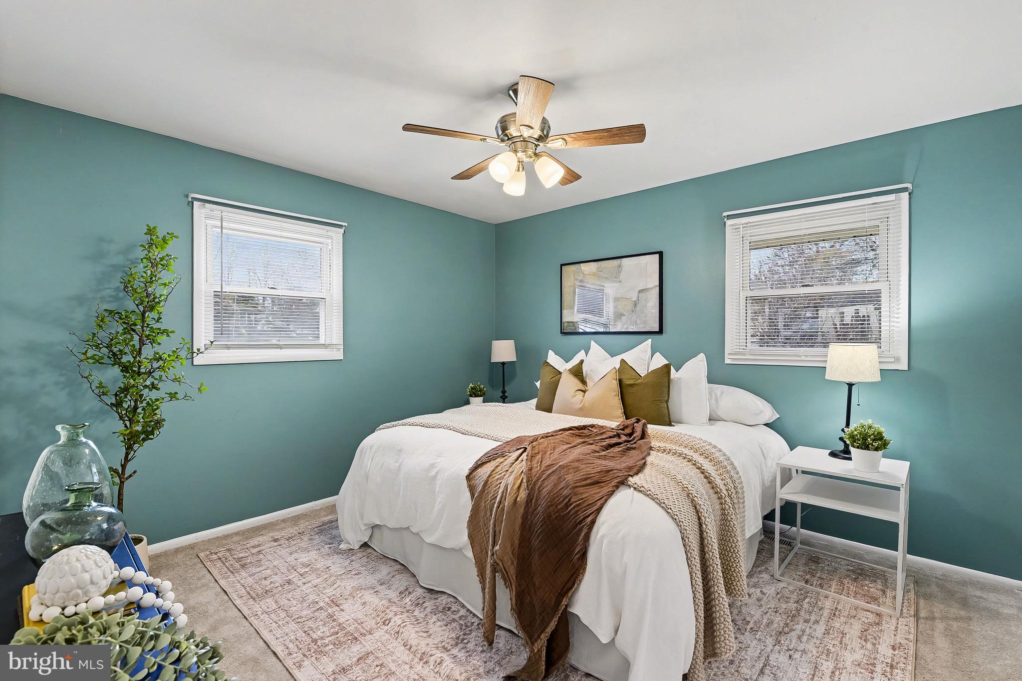 2309 Perry Avenue Edgewood, MD 21040 - Photo 12 of 25 a bedroom with a bed and a chandelier