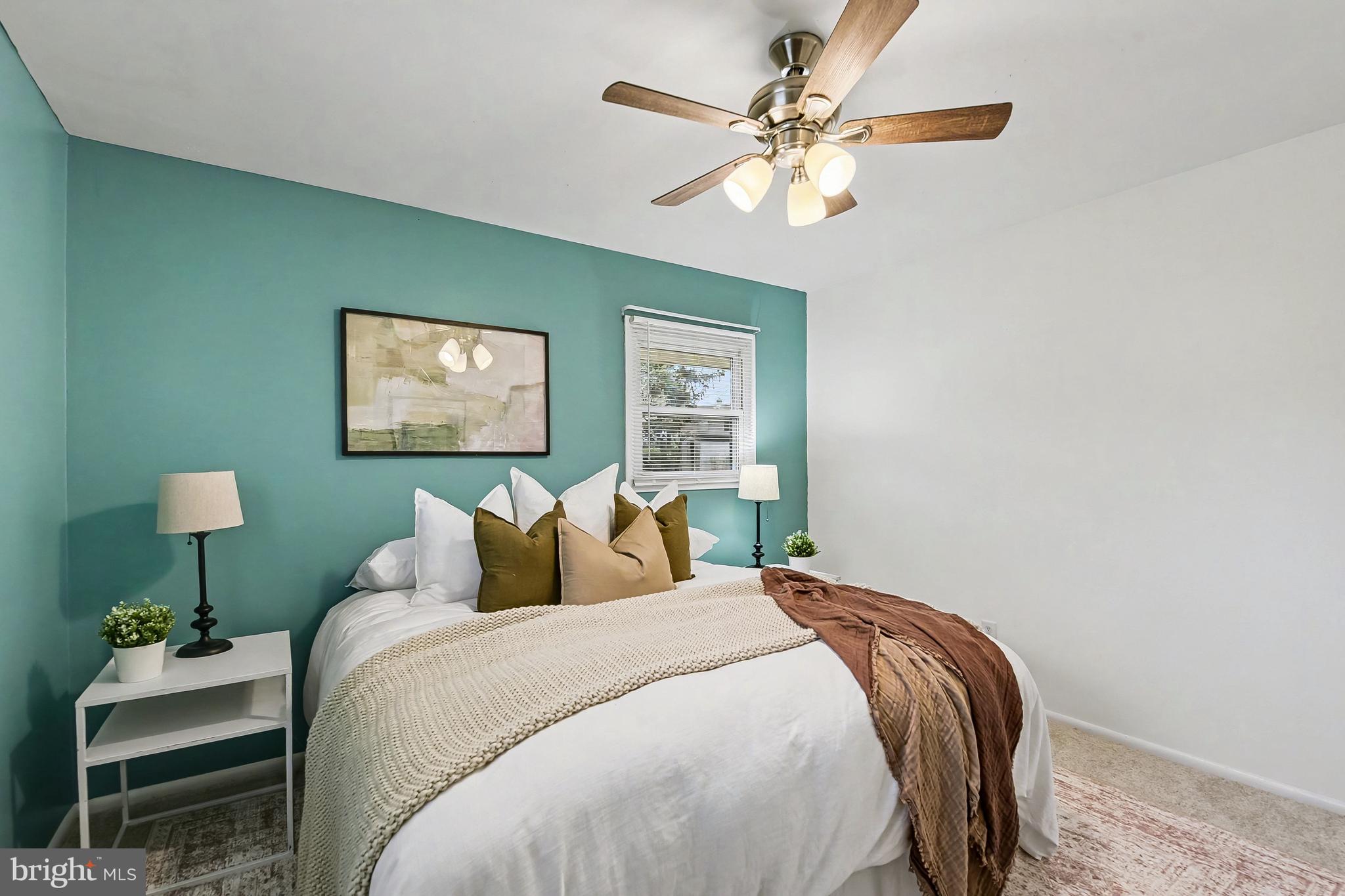 2309 Perry Avenue Edgewood, MD 21040 - Photo 13 of 25 a bedroom with a bed and a chandelier
