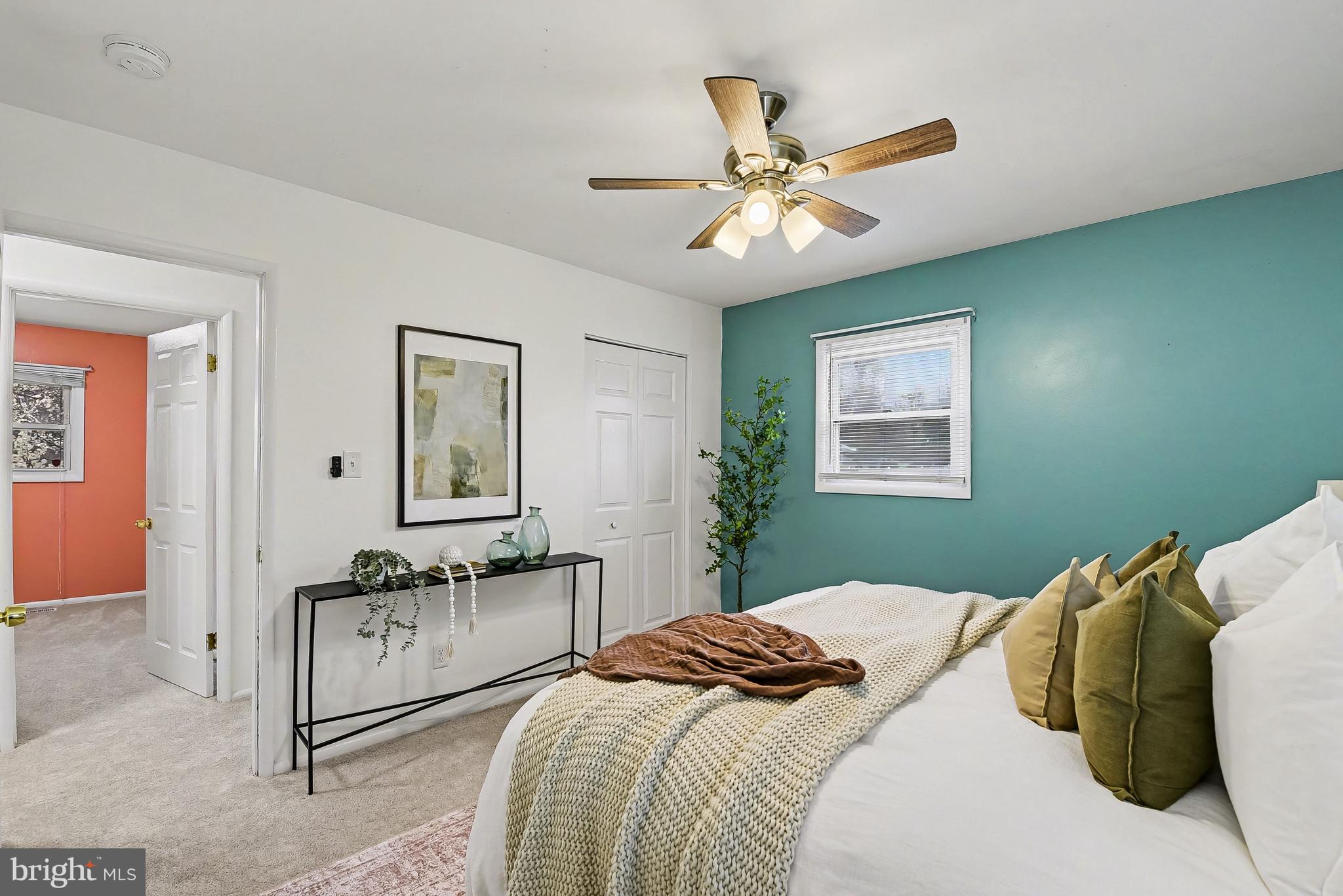 2309 Perry Avenue Edgewood, MD 21040 - Photo 14 of 25 a bedroom with a large bed and a chandelier
