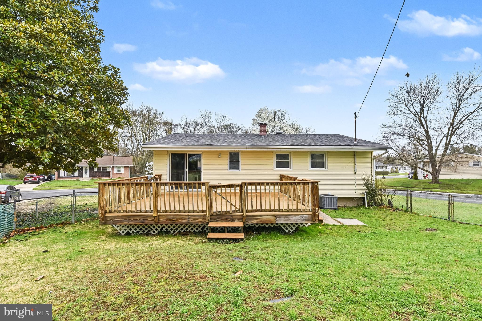 2309 Perry Avenue Edgewood, MD 21040 - Photo 23 of 25 a front view of a house with garden and wooden fence