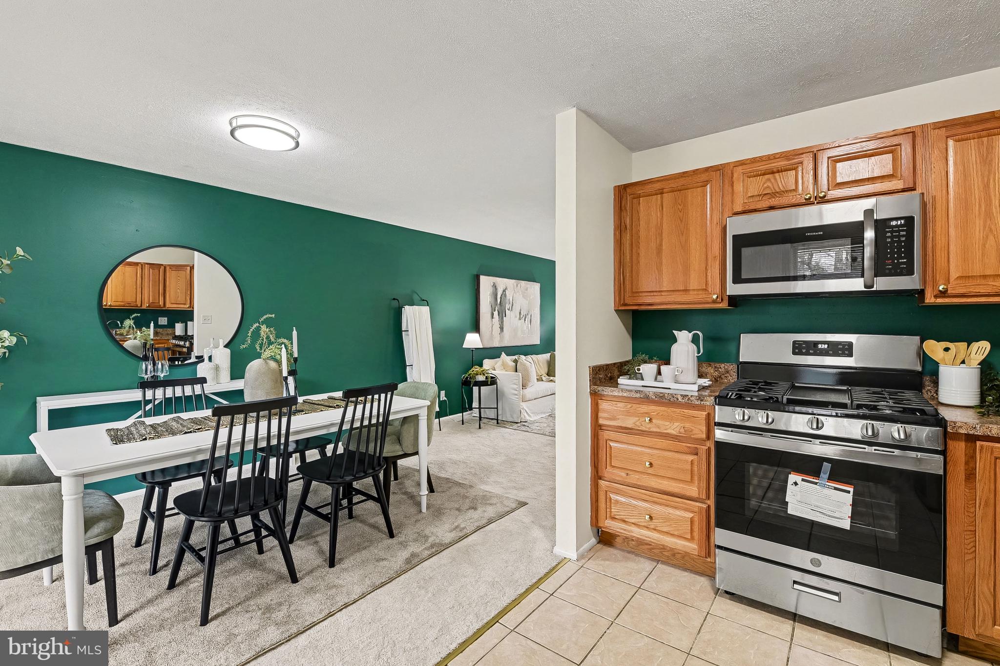 2309 Perry Avenue Edgewood, MD 21040 - Photo 8 of 25 a kitchen with microwave a stove and furniture