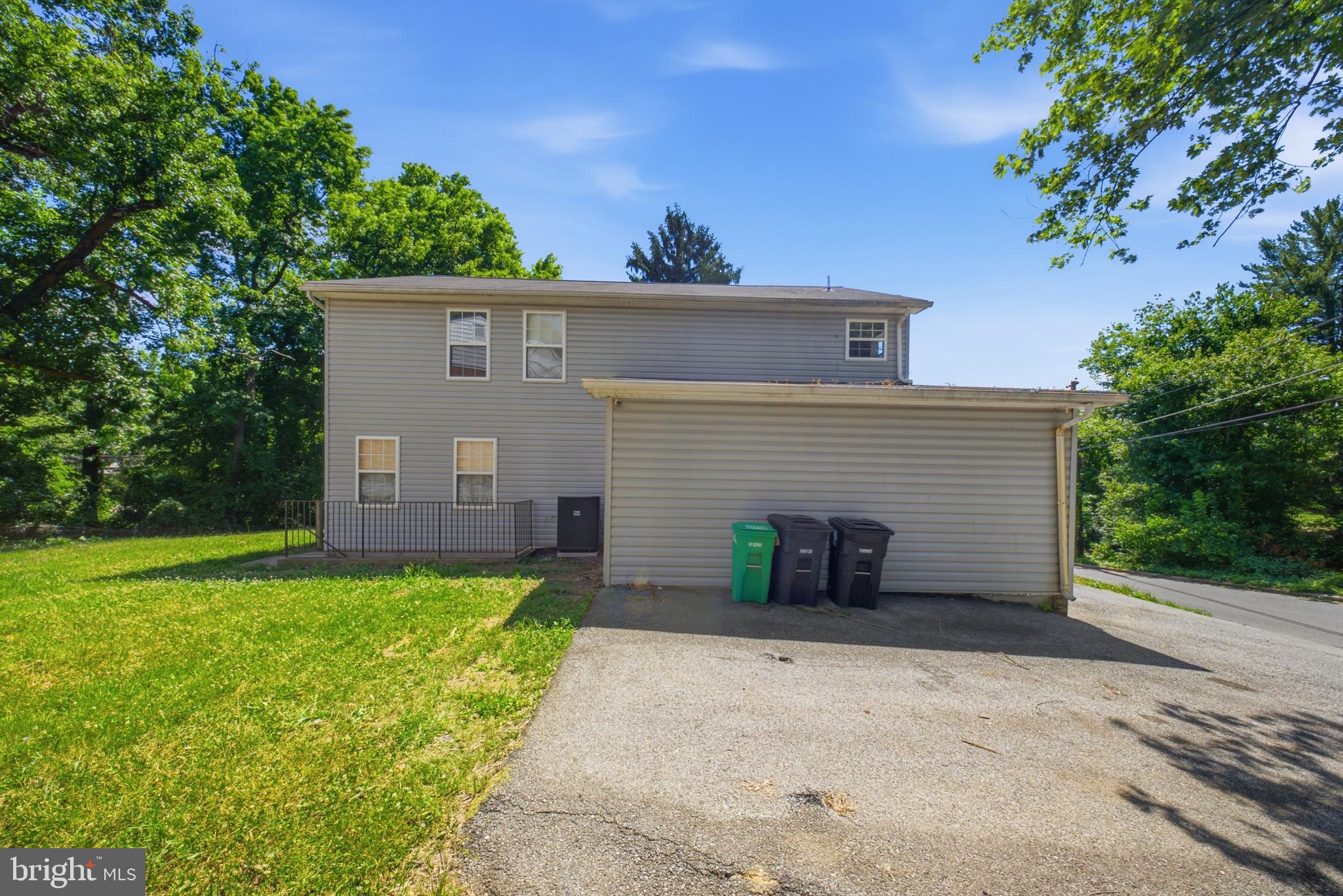 7611 Temple Hill Road Temple Hills, MD 20748 - Photo 2 of 25 front view of a house with a yard