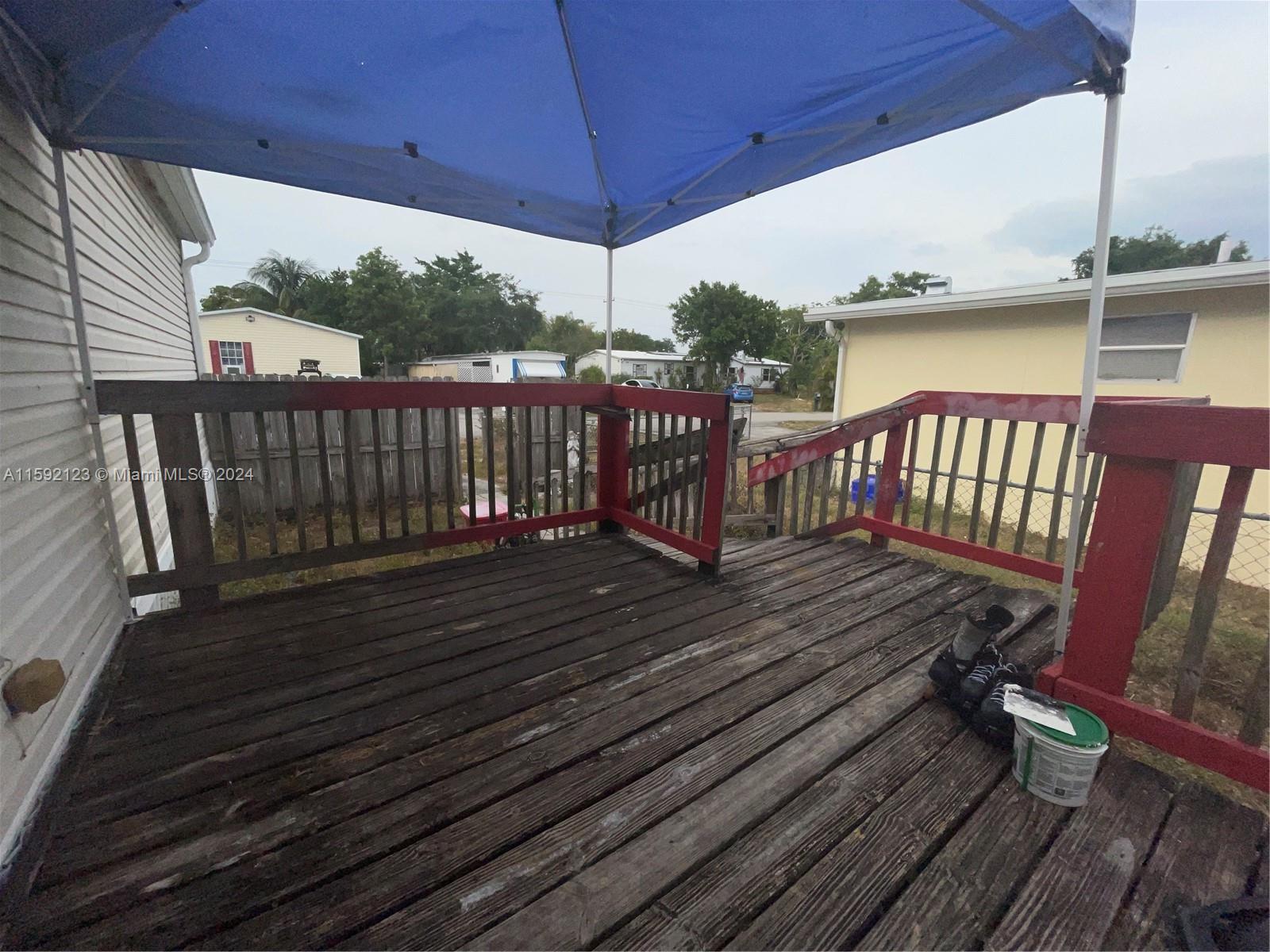 10128 Marlin Drive, Unit 1 Boca Raton, FL 33428 - Photo 11 of 17 a view of balcony with wooden floor
