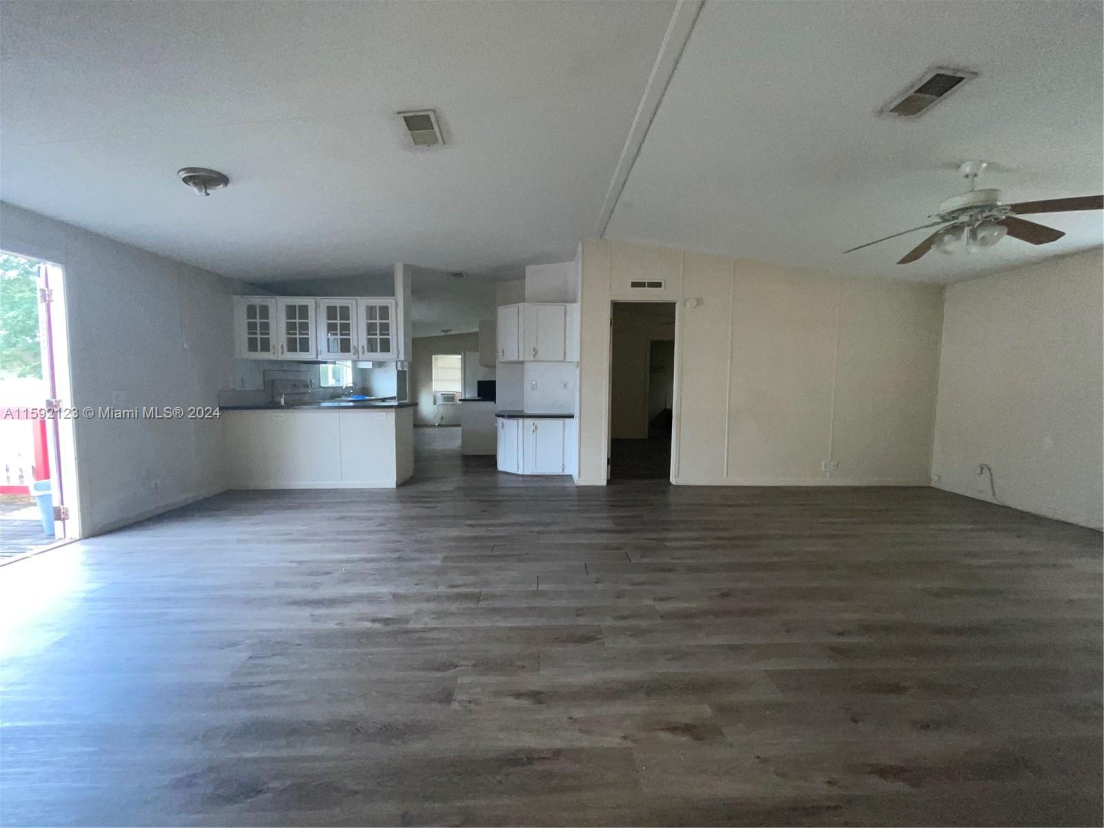 10128 Marlin Drive, Unit 1 Boca Raton, FL 33428 - Photo 17 of 17 a view of a kitchen with a stove and a refrigerator