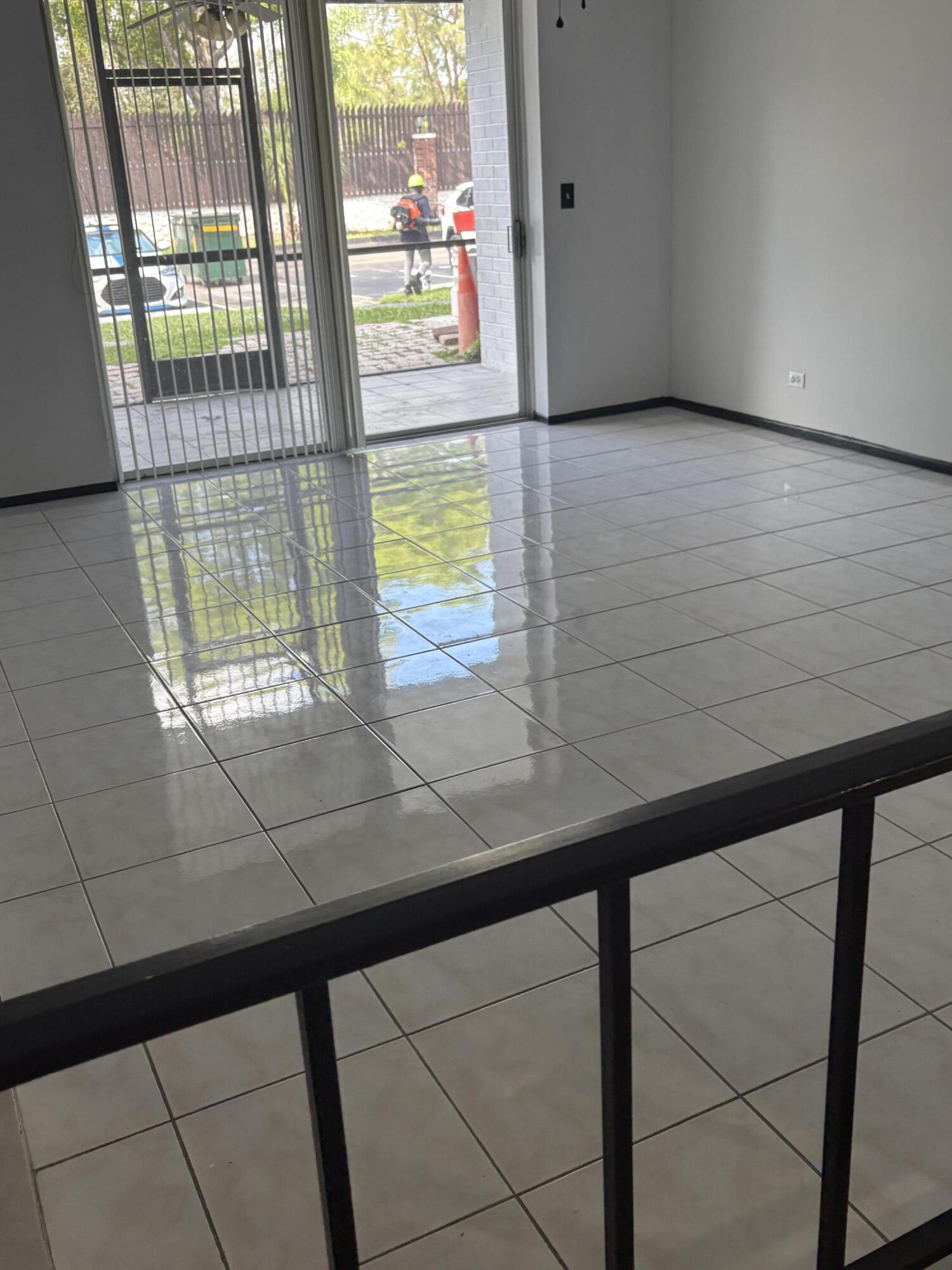 3660 Inverrary Drive, Unit 1B Lauderhill, FL 33319 - Photo 25 of 27 a view of a floor to ceiling window