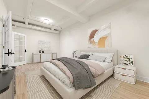 a bedroom with a bed and a couch