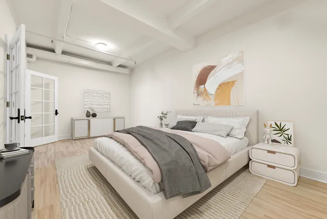 a bedroom with a bed and a couch