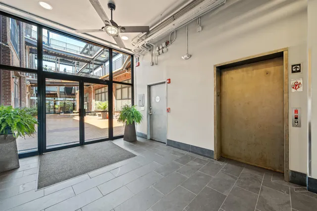 a view of an entryway with a door