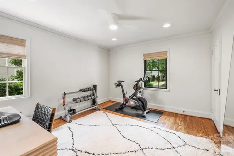 a room with gym equipment and a window